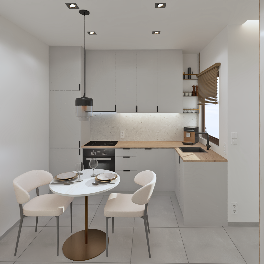 Fully equipped modern kitchenette with white cabinets, wooden countertop, and round dining table for two in Rethymno.